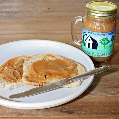 Toast with Pecan Honey Butter next to mug jar
