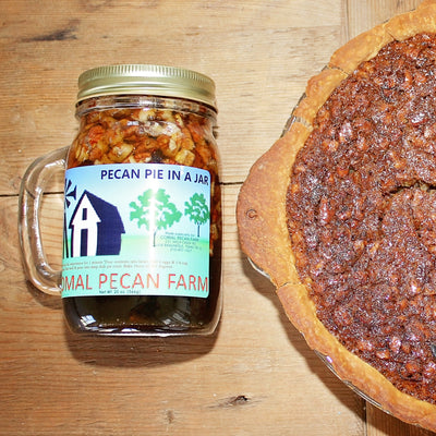 Pecan Pie in a Jar in mug beside fresh baked pecan pie