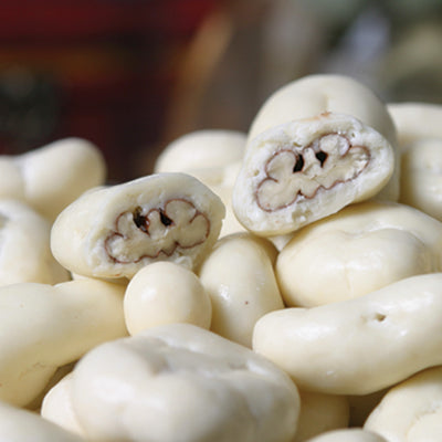 White Chocolate covered Pecans showing one cut open
